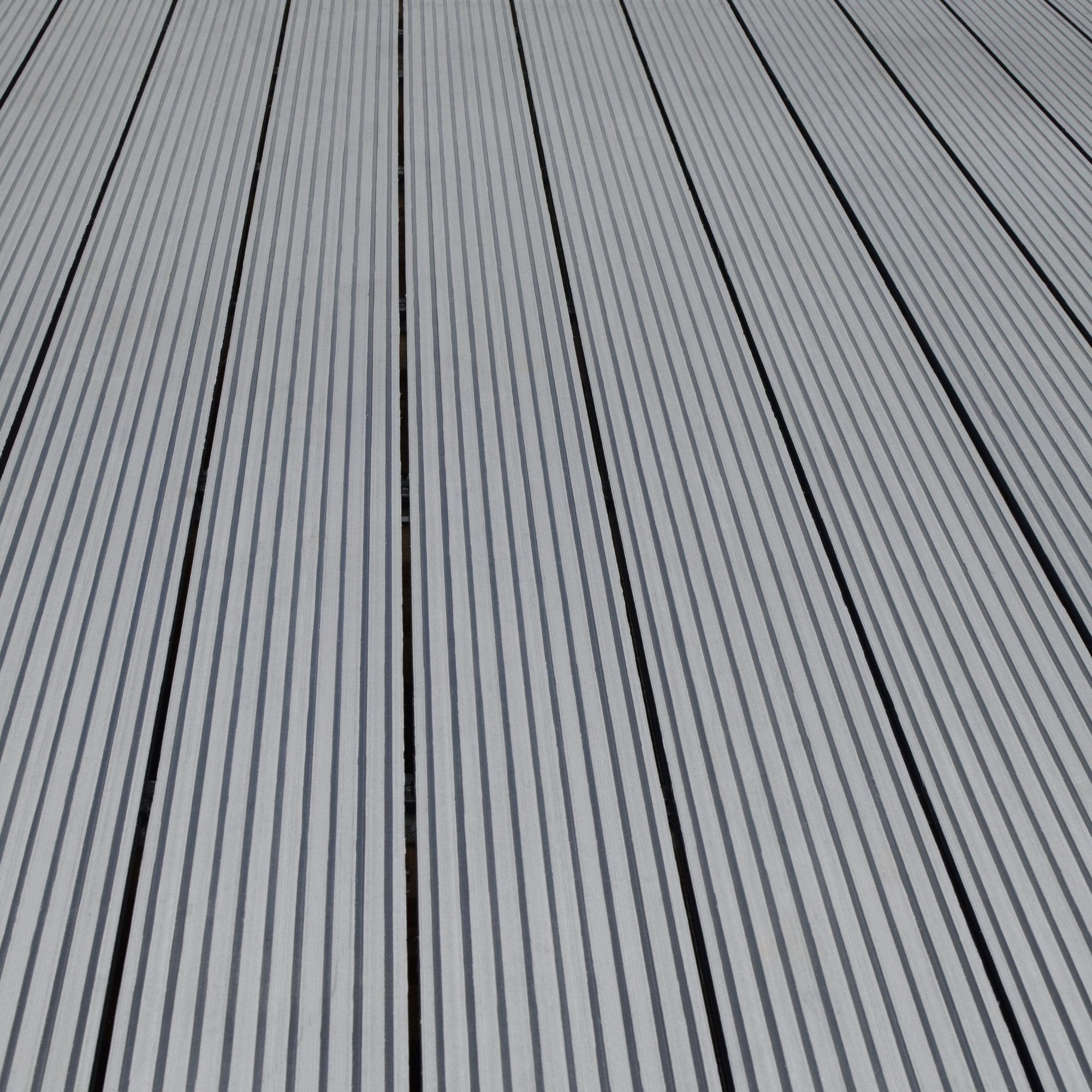 Grey composite decking boards close up installed for outdoor patio area by Superior Pergola Ireland