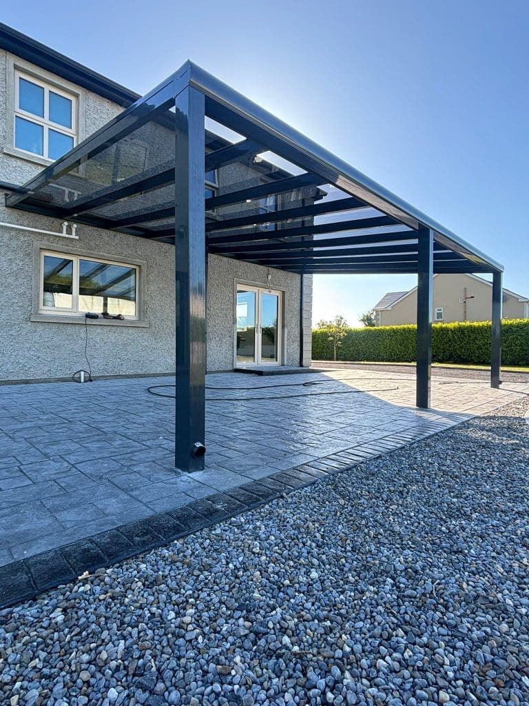 Aluminium pergola with clear glass roof installed on patio in Ireland