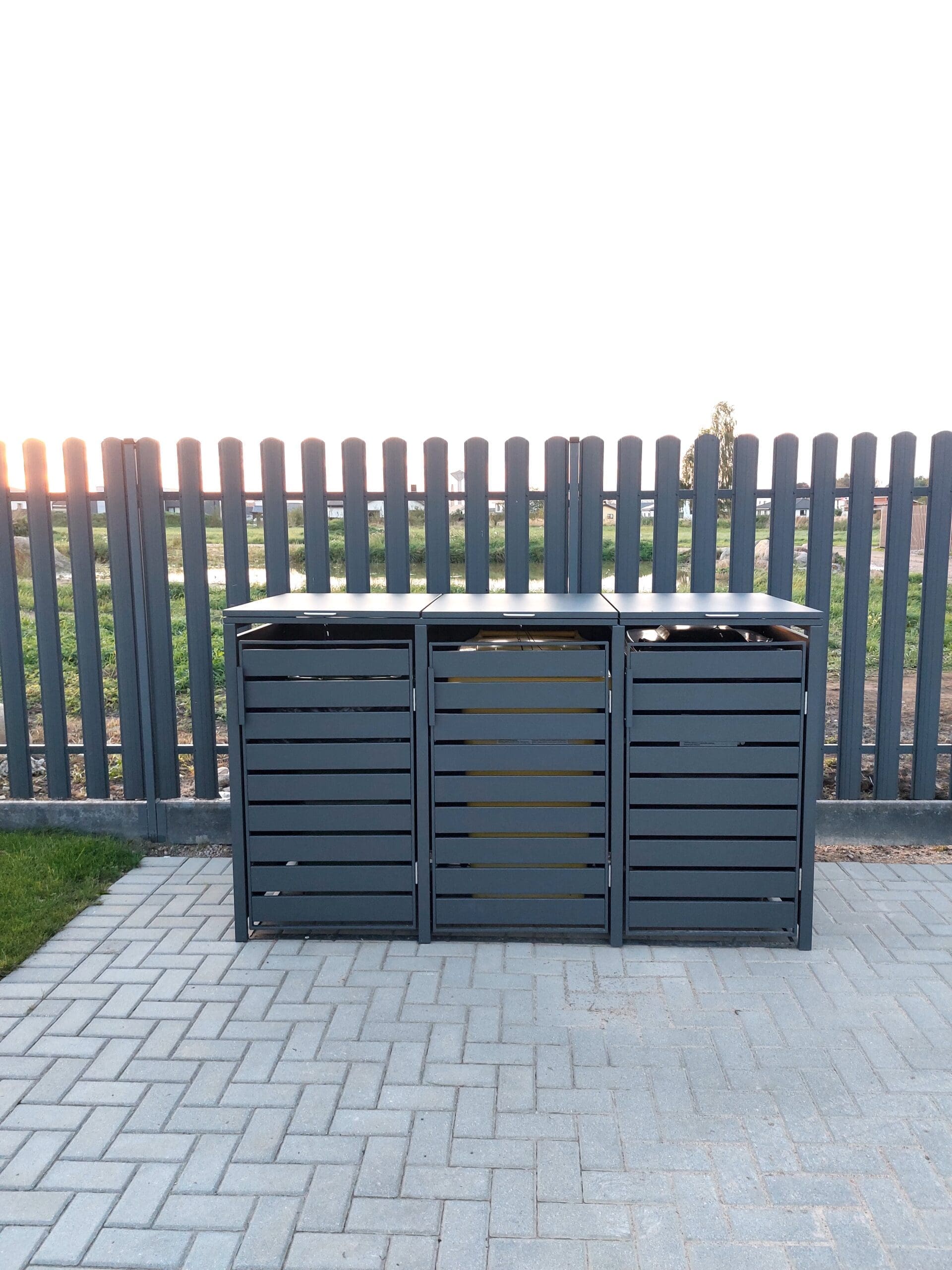 Aluminium wheely bin cover in anthracite grey installed in garden by Superior Pergola Ireland